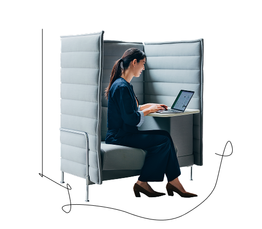 MERIX Financial team member sitting at a cubicle using their laptop